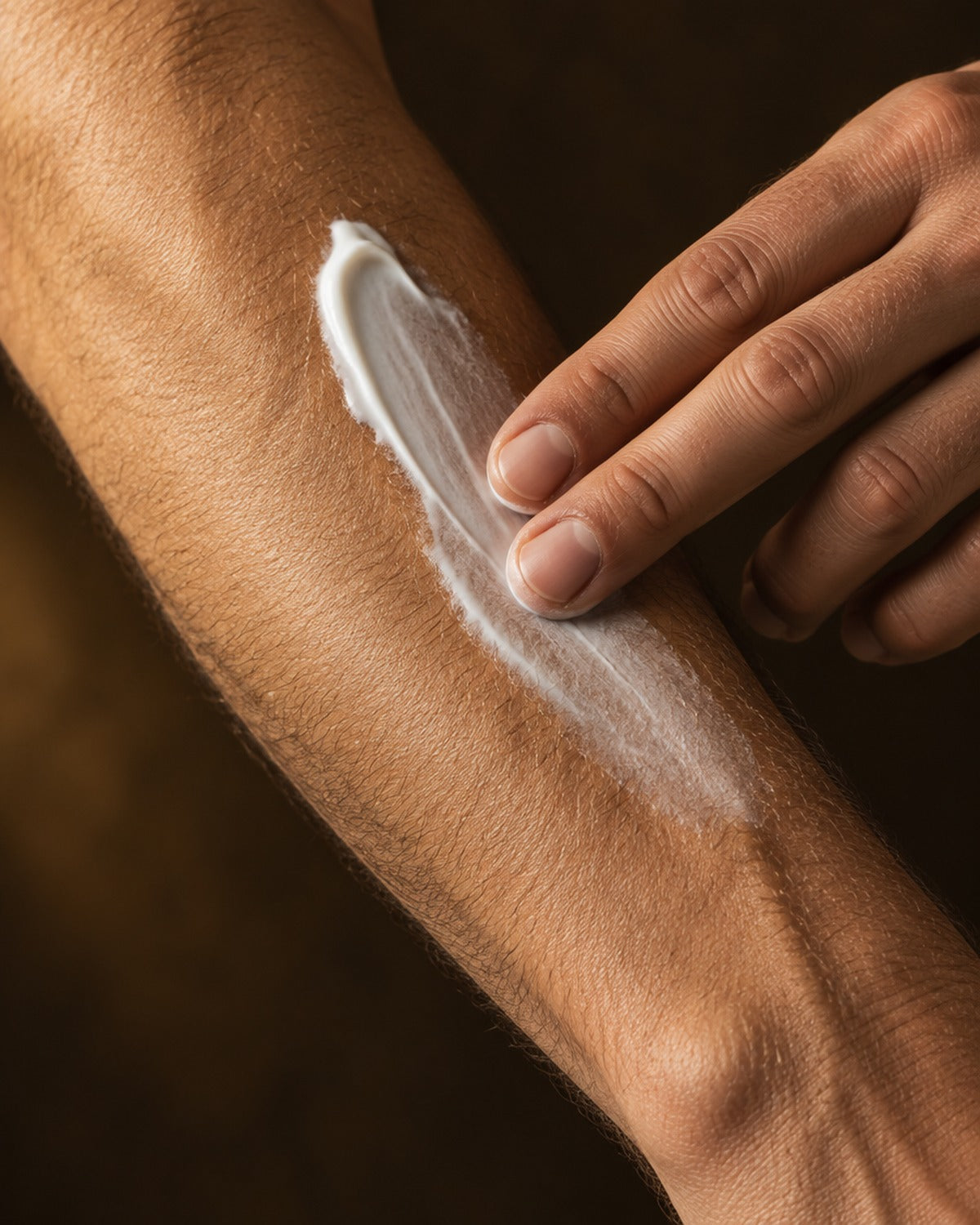 Close-up of body butter half absorbed into skin, matte non-greasy finish Image